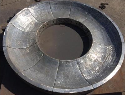 New material for wear-resistant spare parts in cement plants - cast composite parts based on iron re