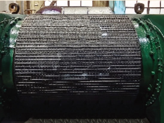 Roller press for surface welding of alloy studs.